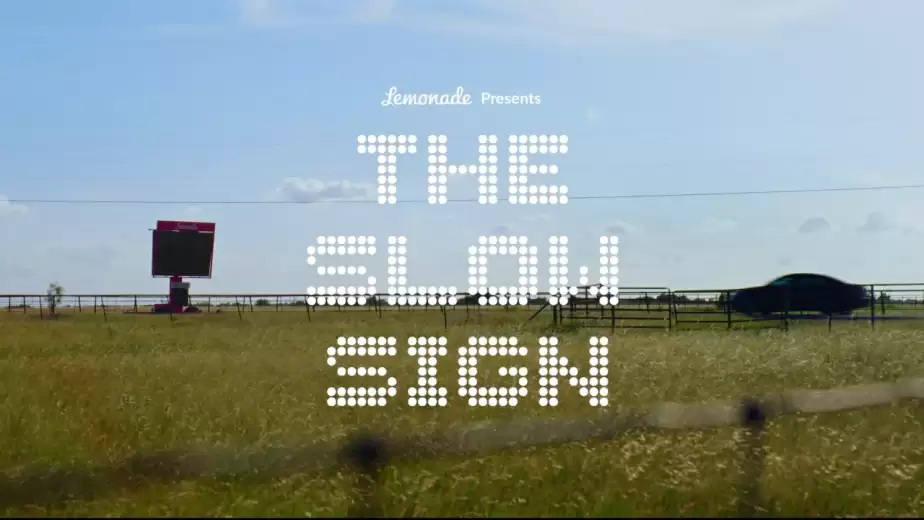 The Slow Sign roadside message board for Lemonade Car Insurance