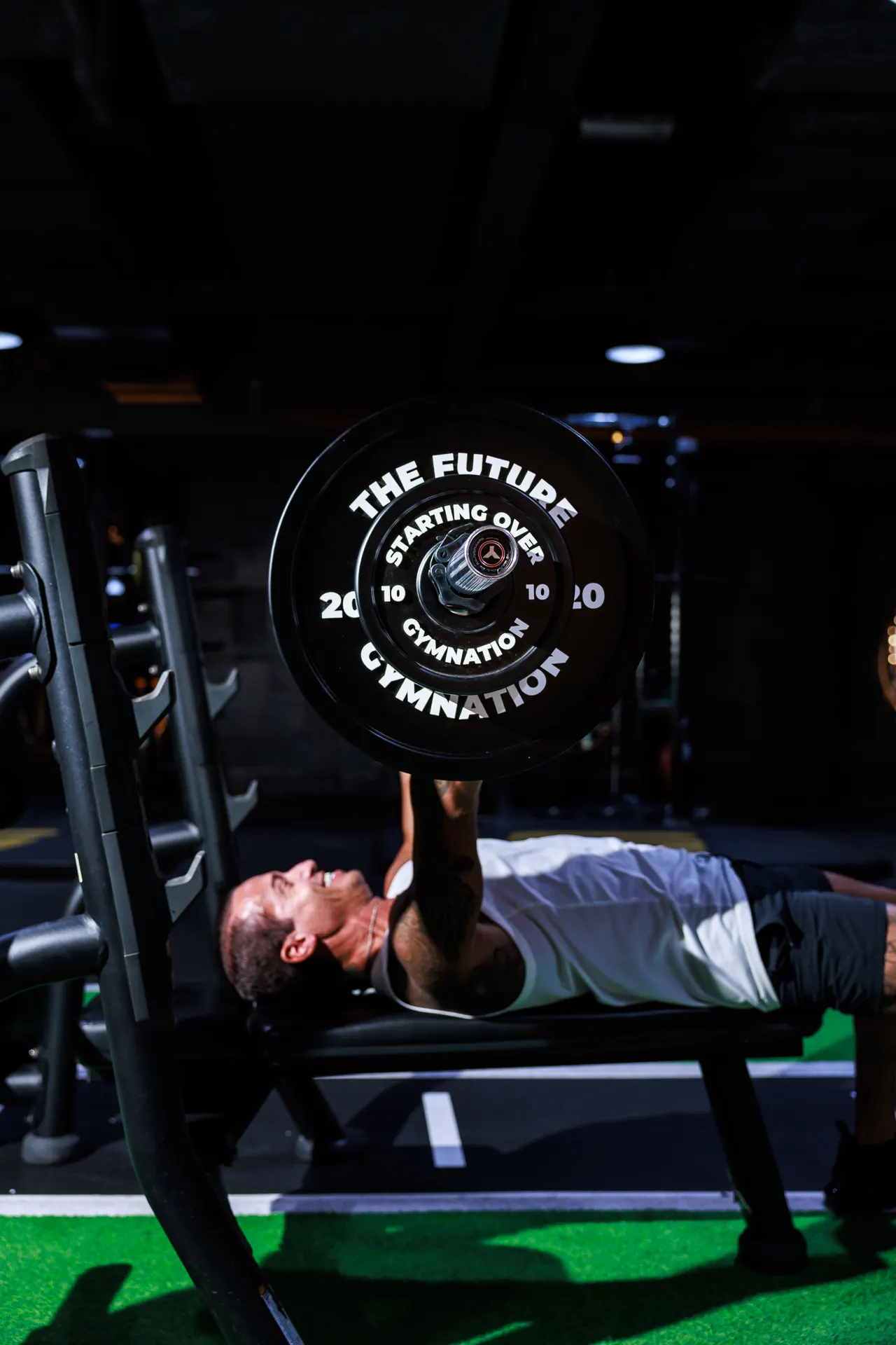 GymNation Worry Bench featuring weight plates inscribed with everyday worries such as The Future, Imposter Syndrome and Doom Scrolling