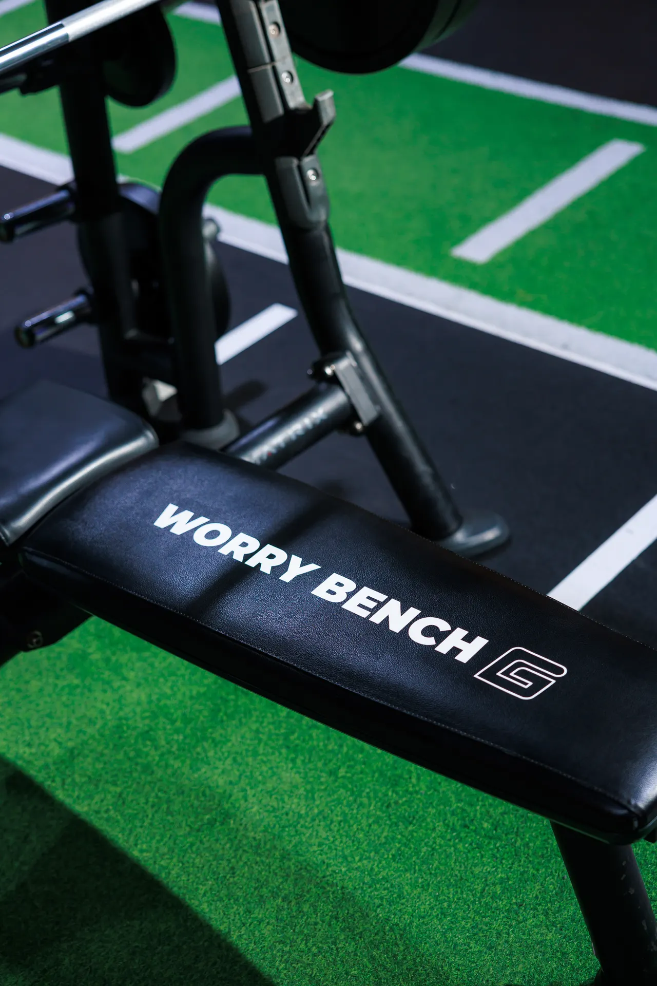 GymNation Worry Bench featuring weight plates inscribed with everyday worries such as The Future, Imposter Syndrome and Doom Scrolling
